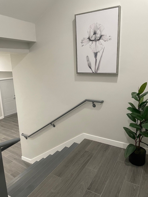 64 Market Street, Unit 401 Lynn, MA 01901 - Photo 13 of 14 a view of a wall with a painting on the wall