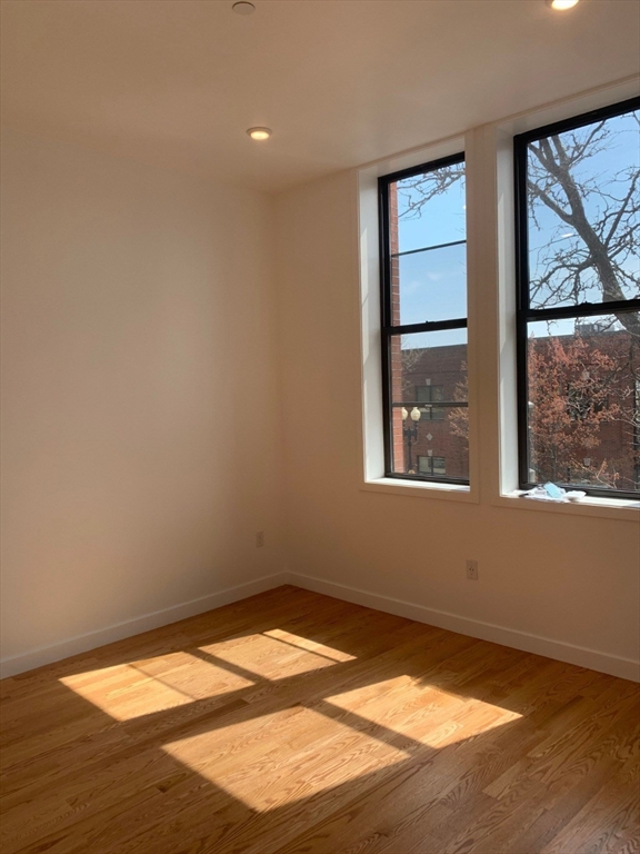 64 Market Street, Unit 401 Lynn, MA 01901 - Photo 7 of 14 an empty room with a window
