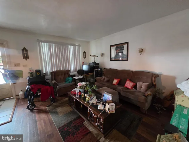 a living room with furniture fireplace and flat screen tv
