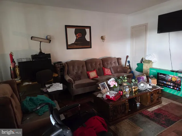 a kitchen with refrigerator and cabinets