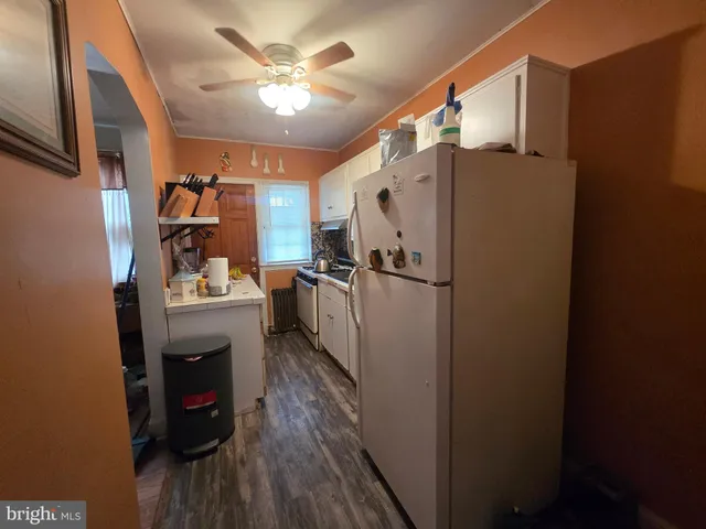 a kitchen with a sink and stove top oven