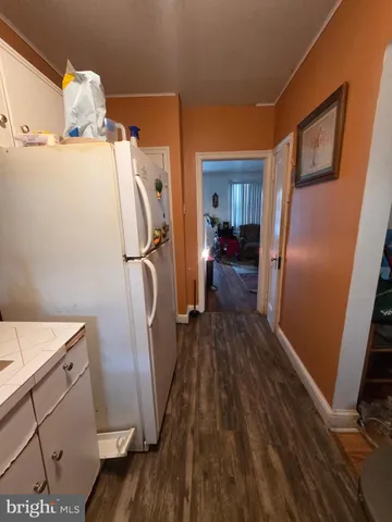 a view of a dining room with furniture and a chandelier