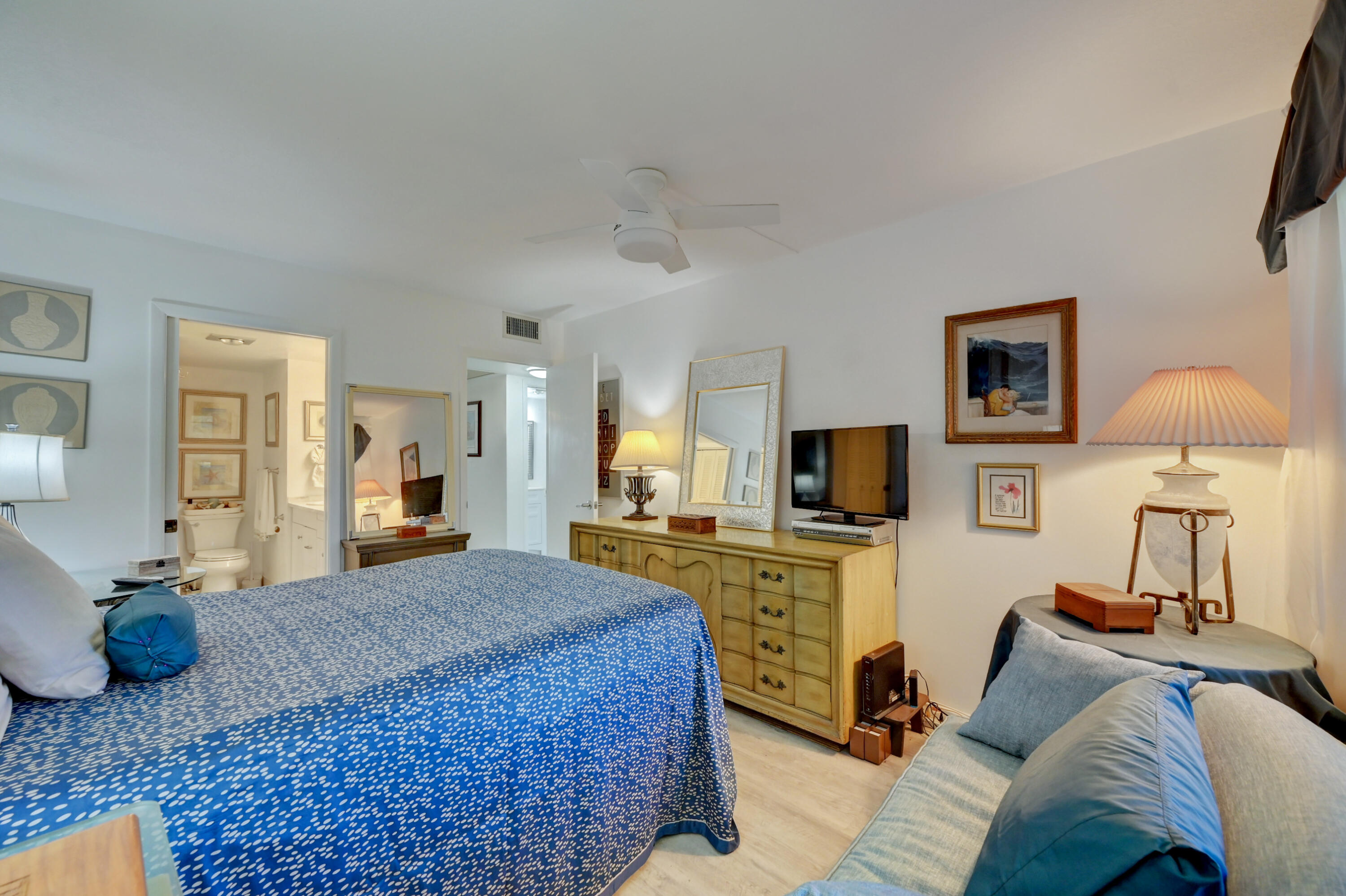 2049 Newcastle A, Unit 2049 Boca Raton, FL 33434 - Photo 15 of 24 a living room with furniture and a flat screen tv