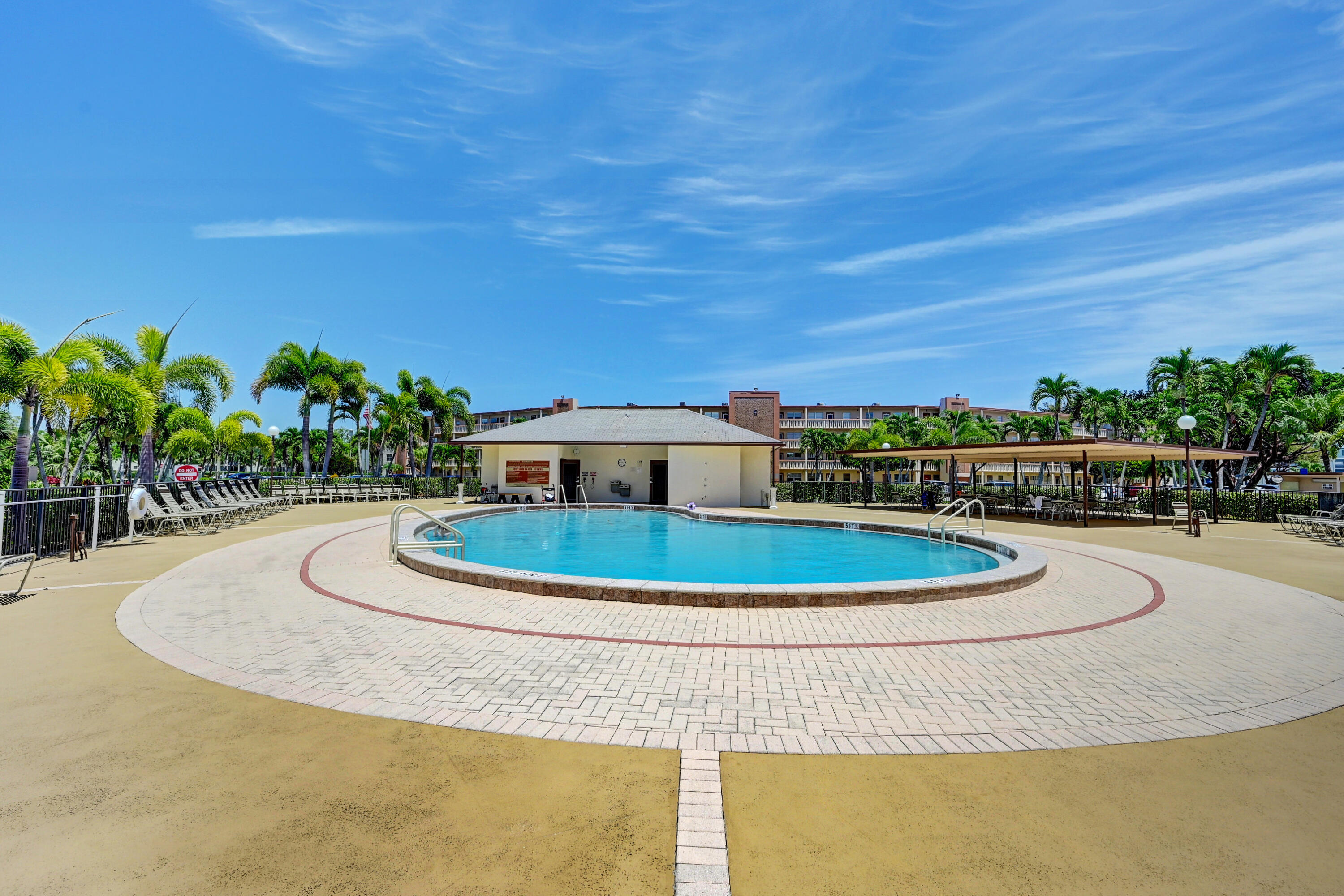 2049 Newcastle A, Unit 2049 Boca Raton, FL 33434 - Photo 22 of 24 a view of a swimming pool with a yard