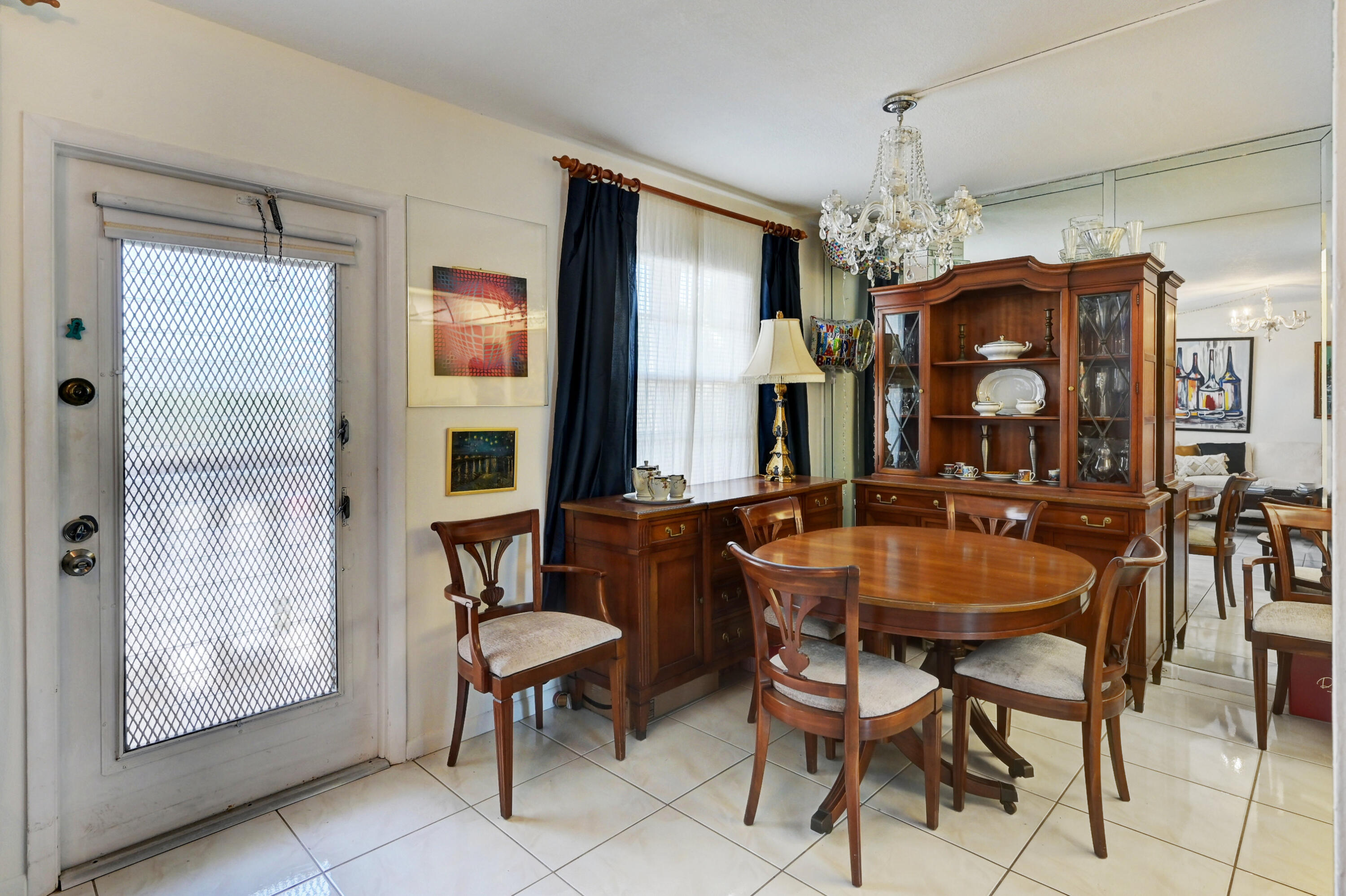 2049 Newcastle A, Unit 2049 Boca Raton, FL 33434 - Photo 6 of 24 a dining room with furniture and window