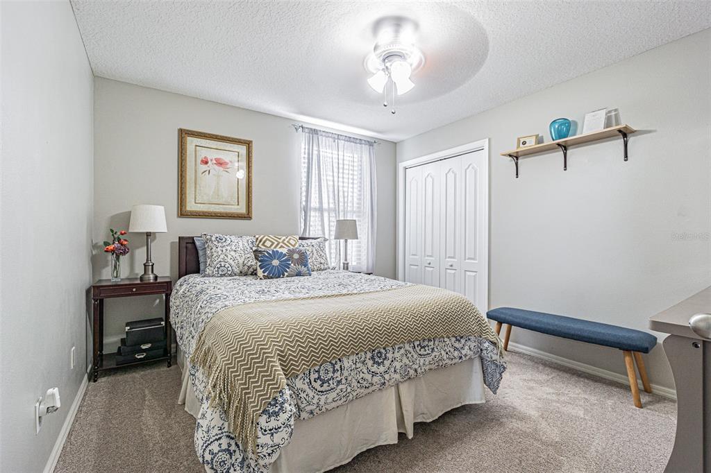 9809 La Rita Place Riverview, FL 33569 - Photo 39 of 59 a bedroom with a bed and a chandelier