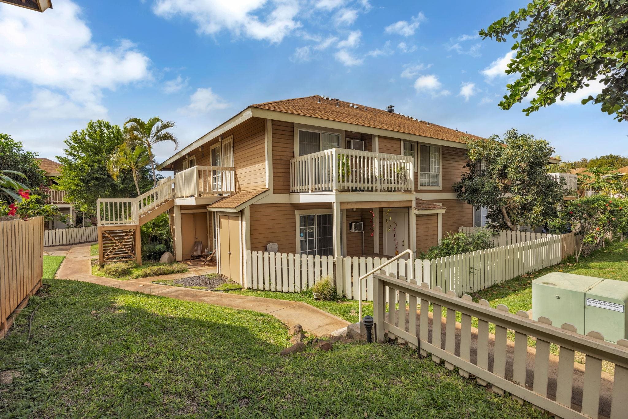 140 Uwapo Road, Unit 9202 Kihei, HI 96753 - Photo 28 of 31 a view of a house with wooden fence