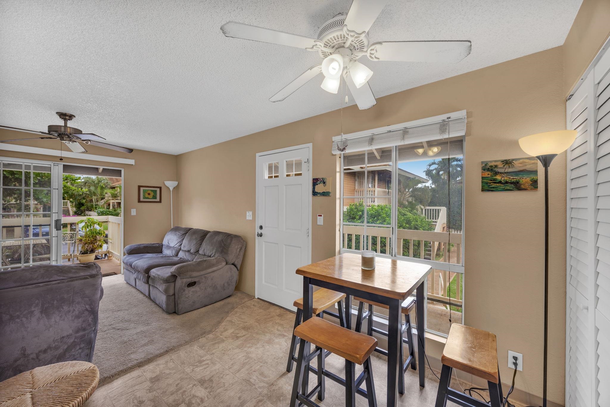 140 Uwapo Road, Unit 9202 Kihei, HI 96753 - Photo 10 of 31 a living room with furniture and a large window