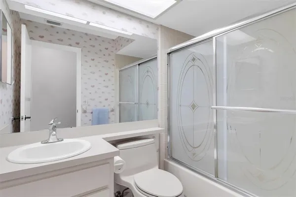 a view of a livingroom with furniture and hardwood floor