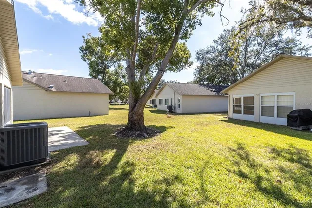 a front view of house with yard and trees