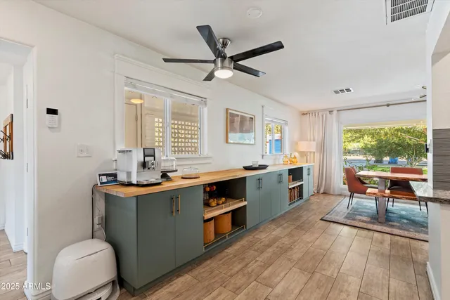 a kitchen with a sink stove and table