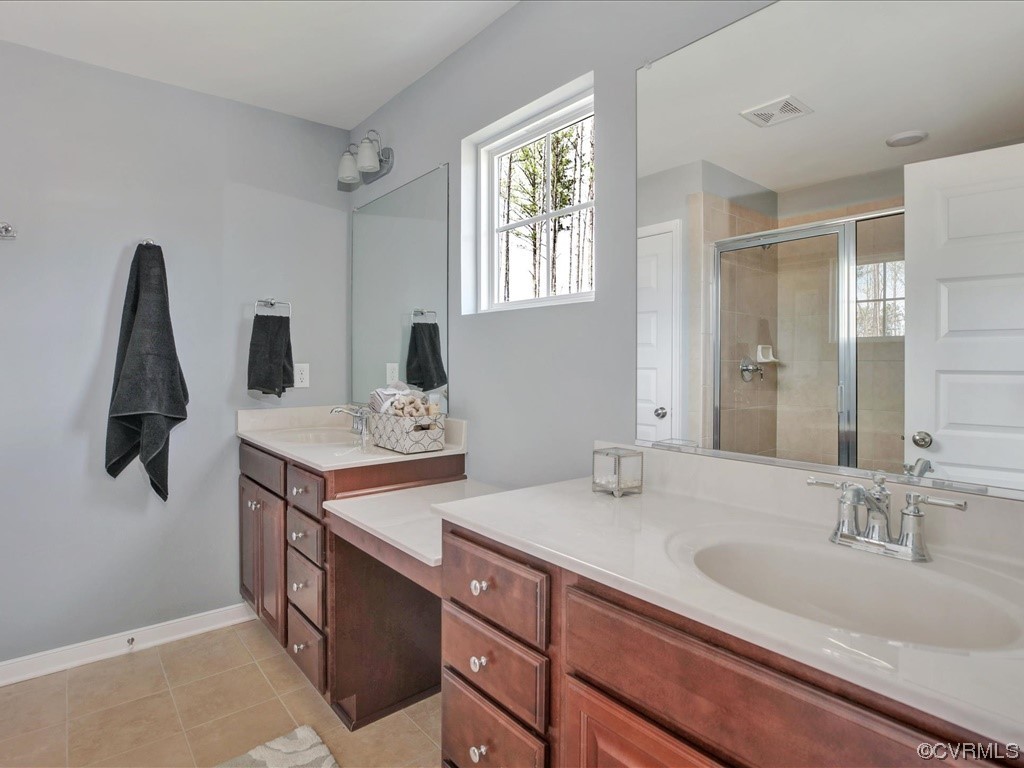 12824 Deep Wl Road Midlothian, VA 23112 - Photo 17 of 44 a bathroom with a sink double vanity and mirror