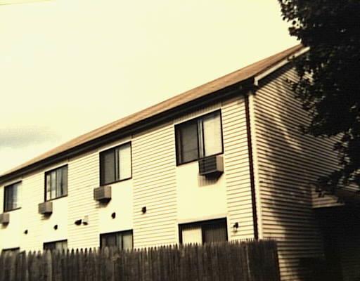 a view of a house with a fence
