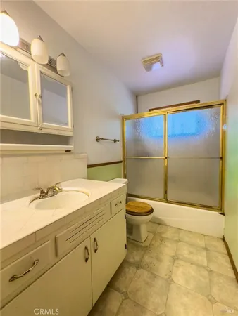 a bedroom with a bed next to a window with outer view
