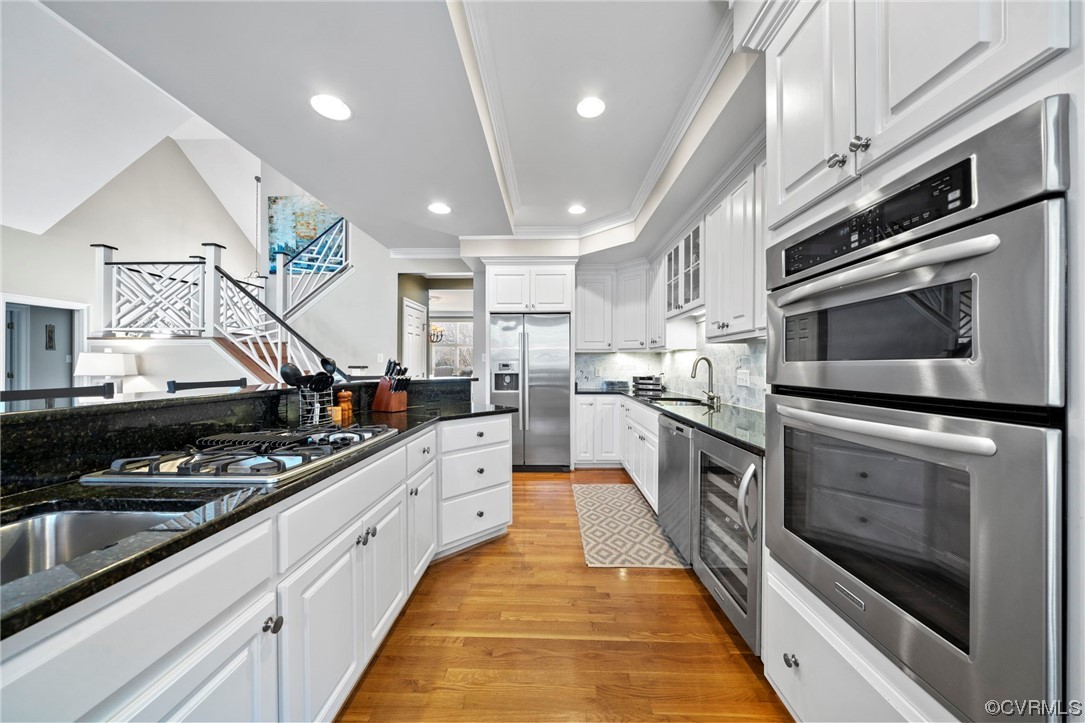 2 Tow Path Circle Richmond, VA 23221 - Photo 11 of 32 a kitchen with stainless steel appliances kitchen island granite countertop a stove and a sink