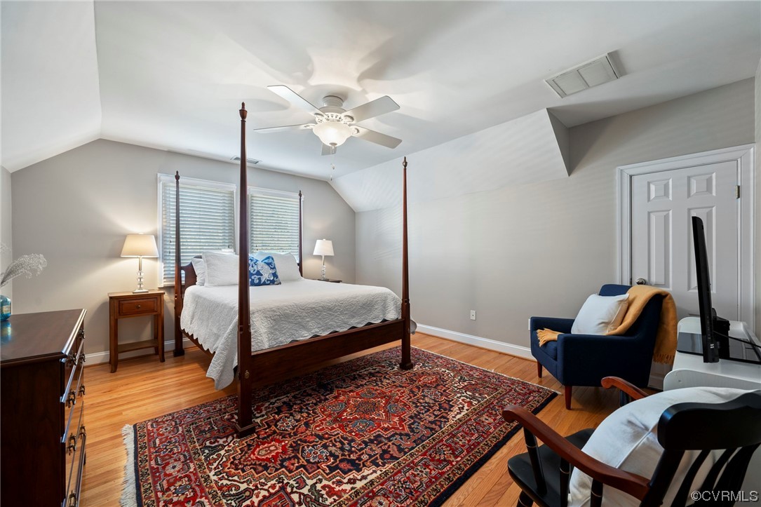 2 Tow Path Circle Richmond, VA 23221 - Photo 22 of 32 a bedroom with a bed and wooden floor