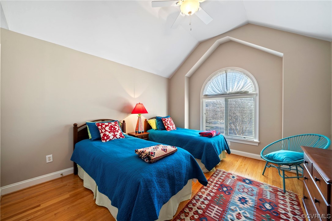 2 Tow Path Circle Richmond, VA 23221 - Photo 23 of 32 a bedroom with two beds and a chandelier