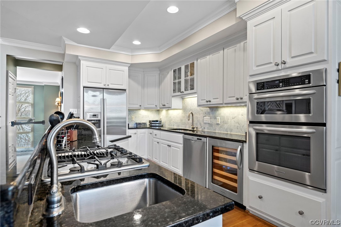 2 Tow Path Circle Richmond, VA 23221 - Photo 10 of 32 a kitchen with granite countertop a stove and a sink