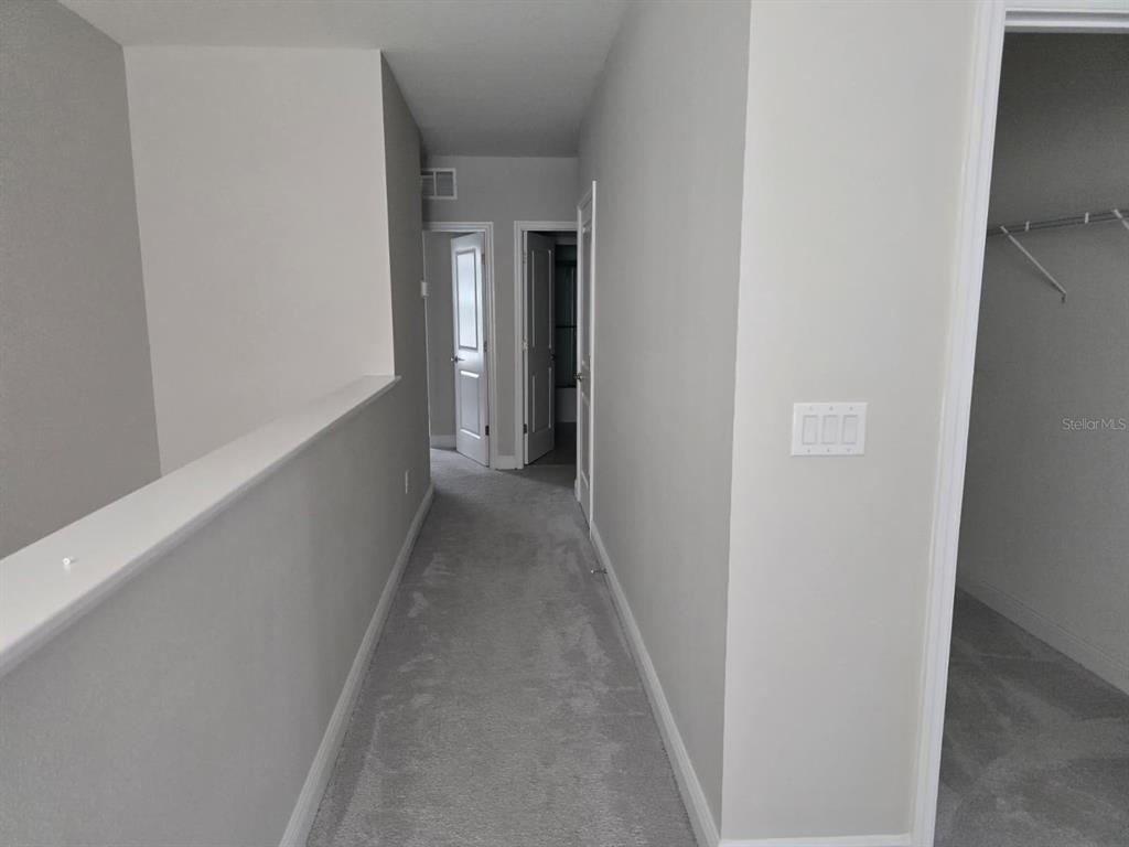 10916 Honor Road Tampa, FL 33625 - Photo 26 of 36 a view of a hallway with wooden floor