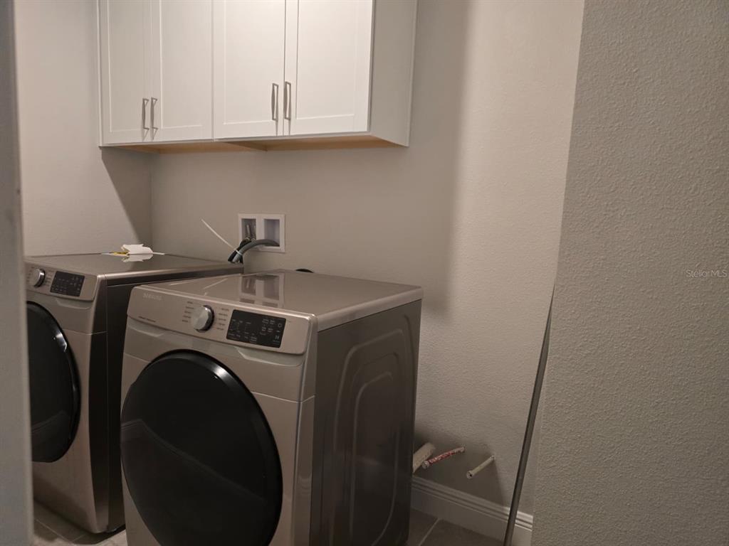 10916 Honor Road Tampa, FL 33625 - Photo 28 of 36 a utility room with dryer and washer