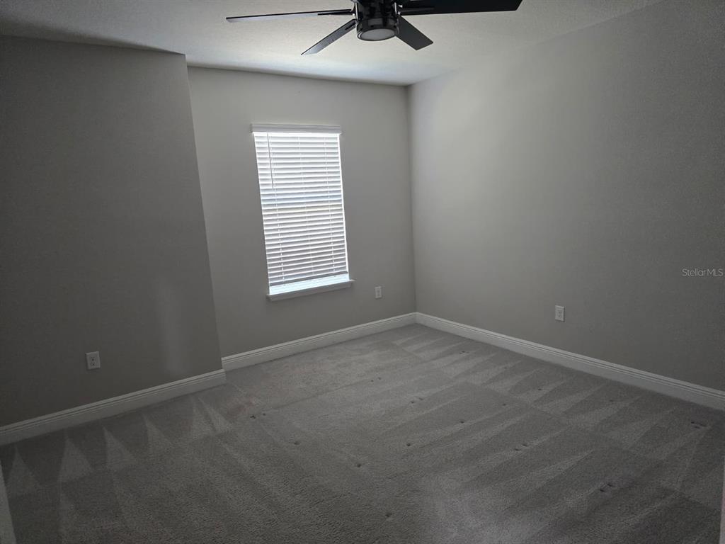 10916 Honor Road Tampa, FL 33625 - Photo 31 of 36 an empty room with a window