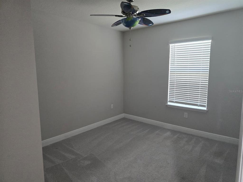 10916 Honor Road Tampa, FL 33625 - Photo 32 of 36 an empty room with a window