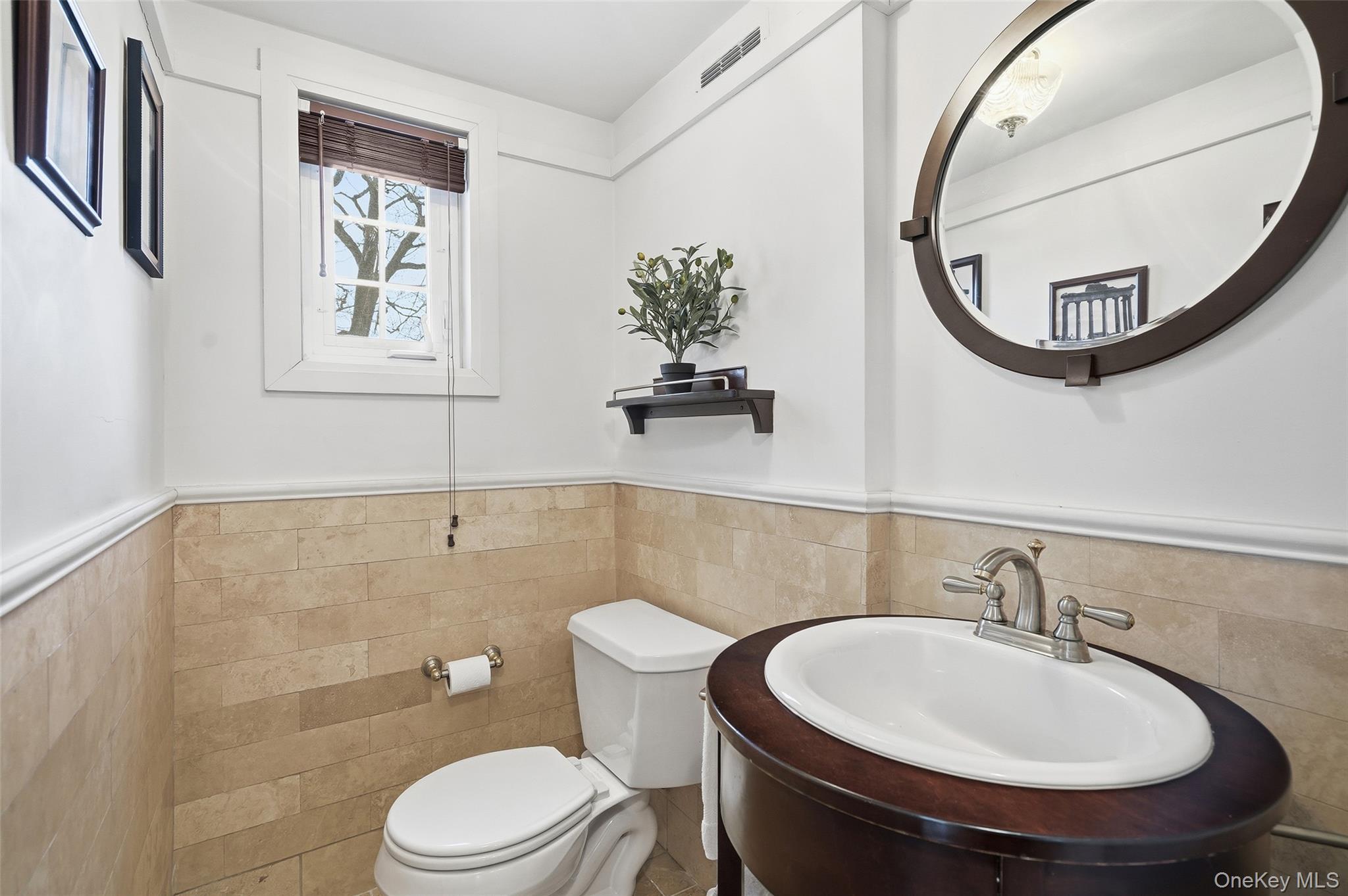 42 Sargent Road Scarsdale, NY 10583 - Photo 11 of 27 Bathroom featuring vanity, tiled wainscoting adding texture and character.