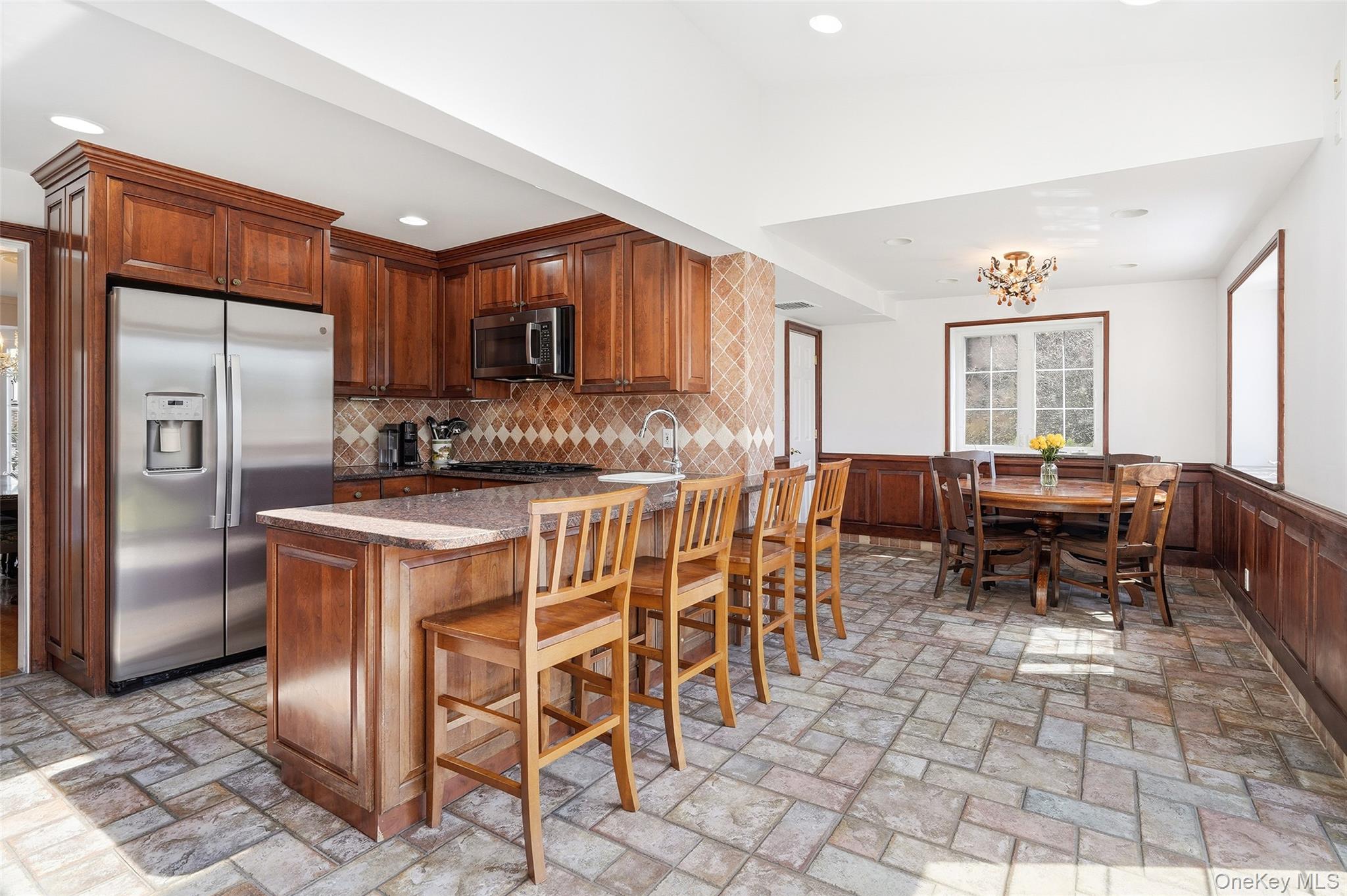 42 Sargent Road Scarsdale, NY 10583 - Photo 8 of 27 Spacious Eat in Kitchen with wainscoted walls.