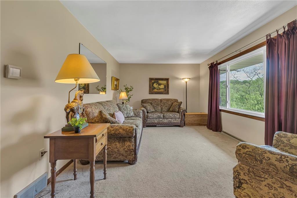 383 Ridgemont Drive Midland, PA 15059 - Photo 29 of 44 a living room with furniture and a lamp