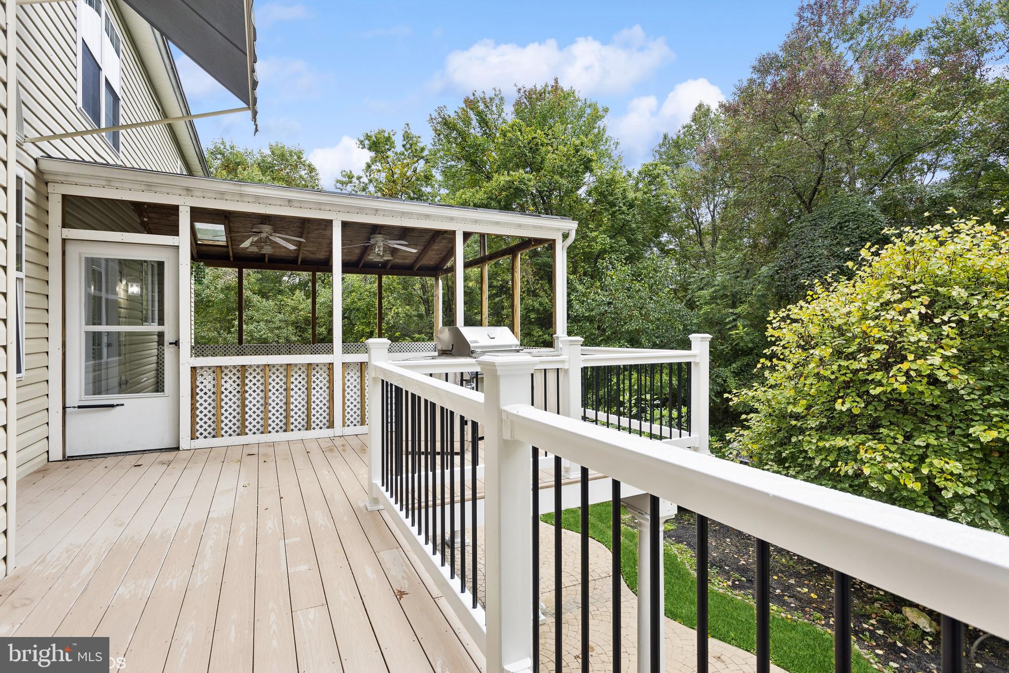 818 Hoods Mill Road Cooksville, MD 21723 - Photo 104 of 108 a view of a wooden deck and a yard