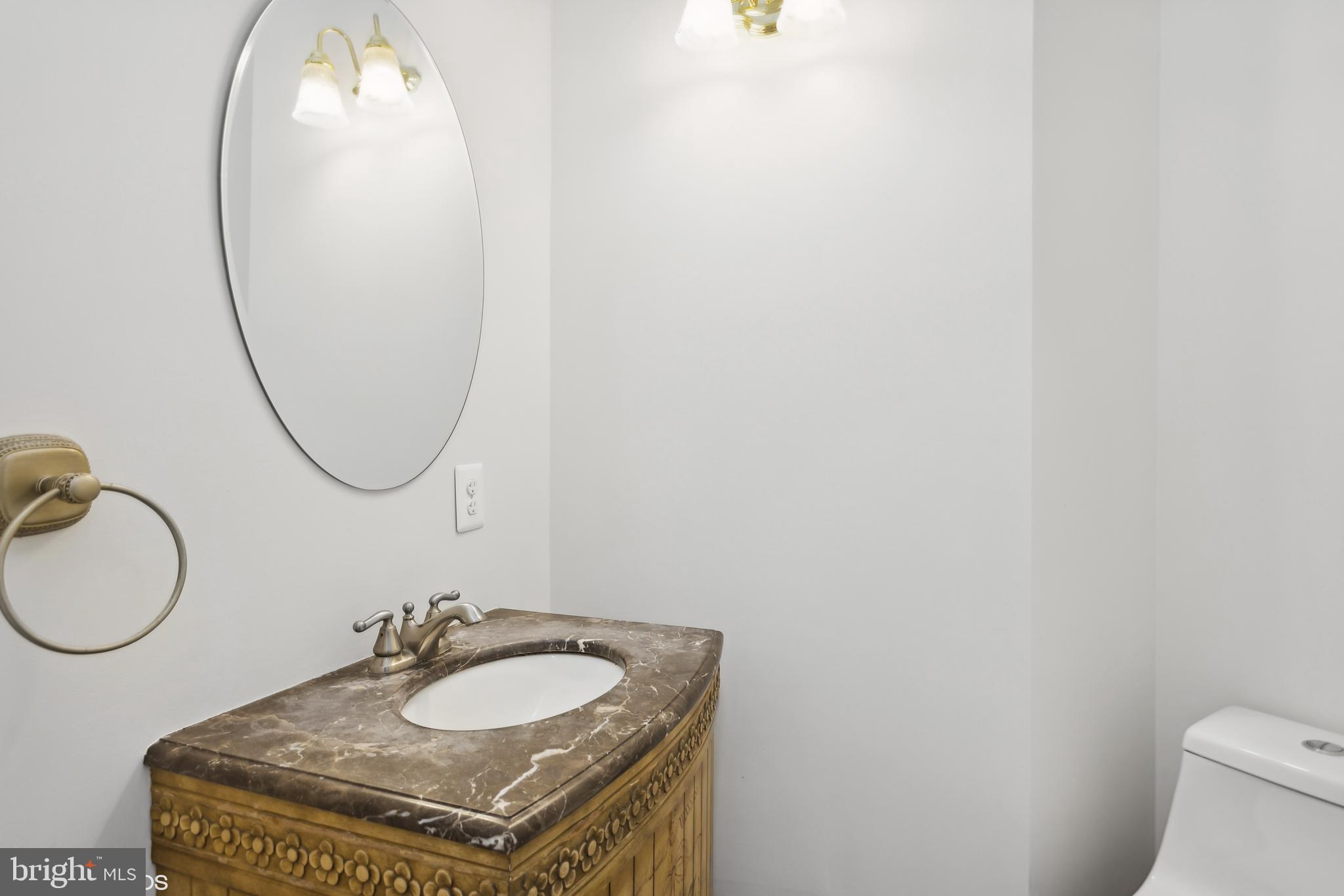 818 Hoods Mill Road Cooksville, MD 21723 - Photo 18 of 108 a bathroom with a sink and a mirror