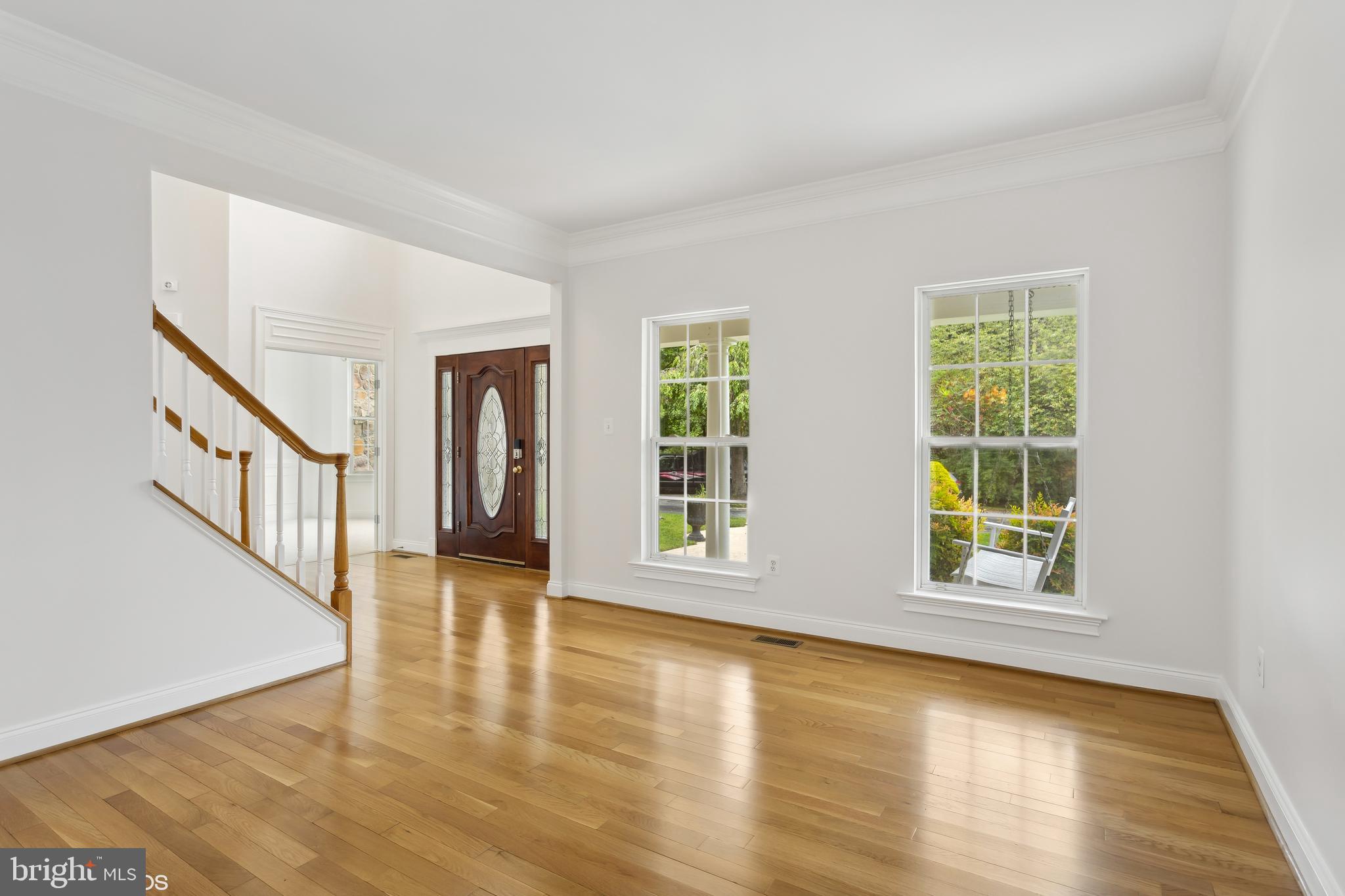 818 Hoods Mill Road Cooksville, MD 21723 - Photo 20 of 108 a view of an empty room with window and wooden floor