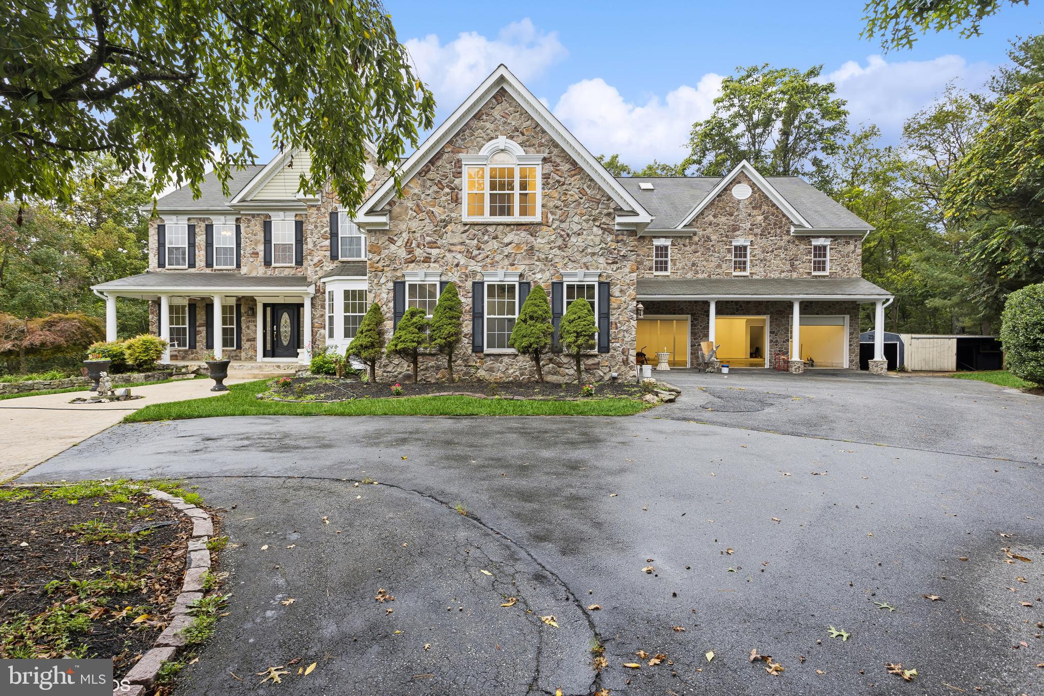 818 Hoods Mill Road Cooksville, MD 21723 - Photo 2 of 108 a front view of a house with a garden