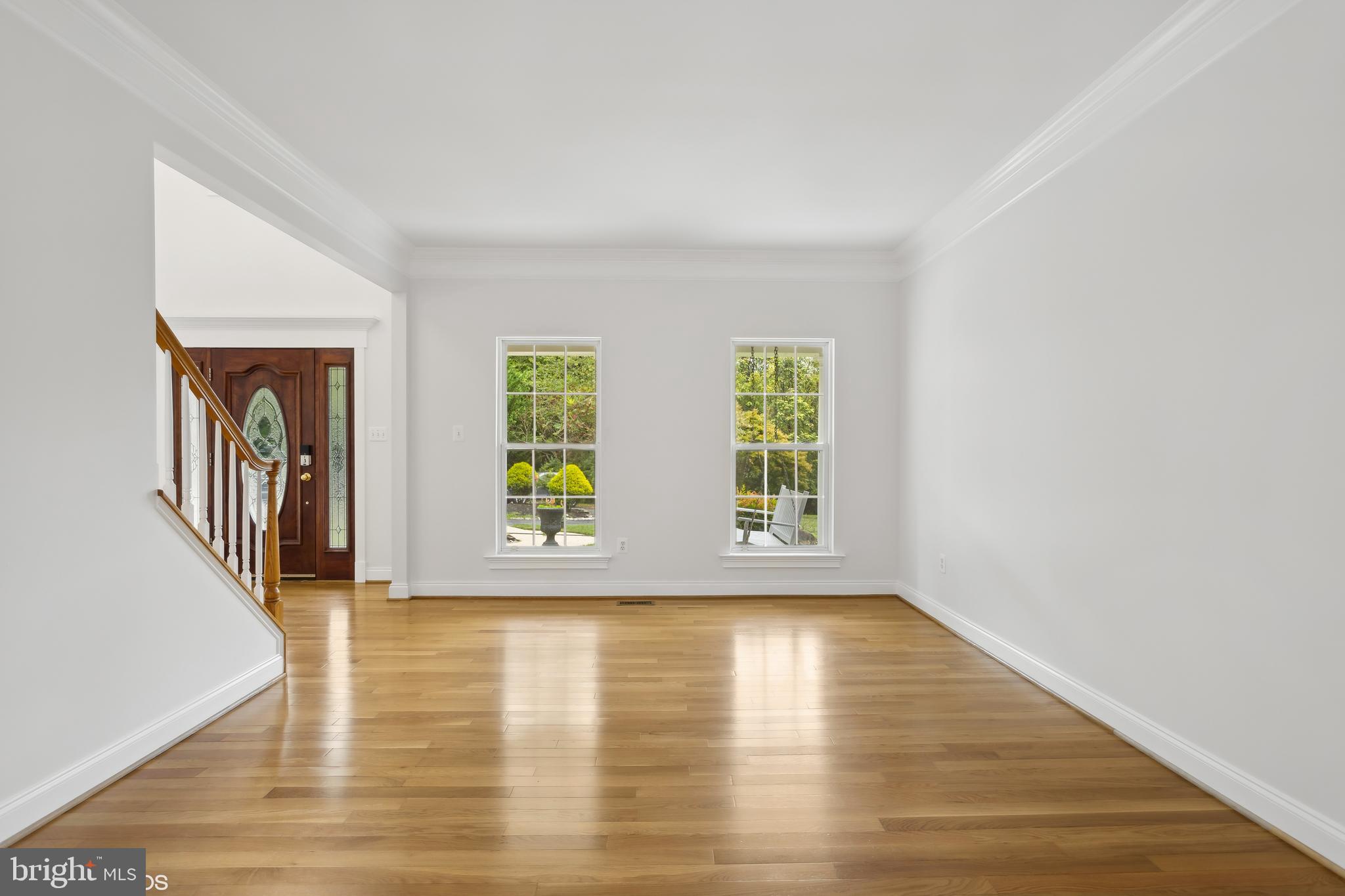 818 Hoods Mill Road Cooksville, MD 21723 - Photo 21 of 108 a view of an empty room with wooden floor and a window