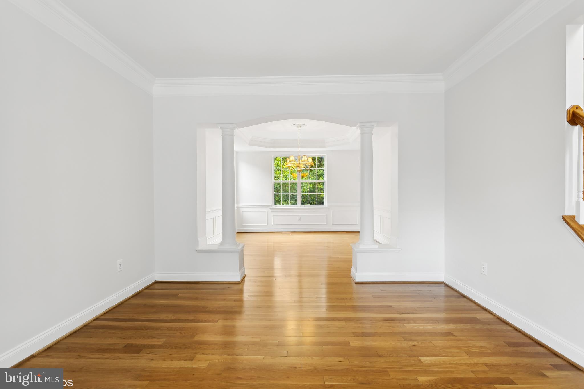 818 Hoods Mill Road Cooksville, MD 21723 - Photo 22 of 108 a view of an empty room with wooden floor and a window