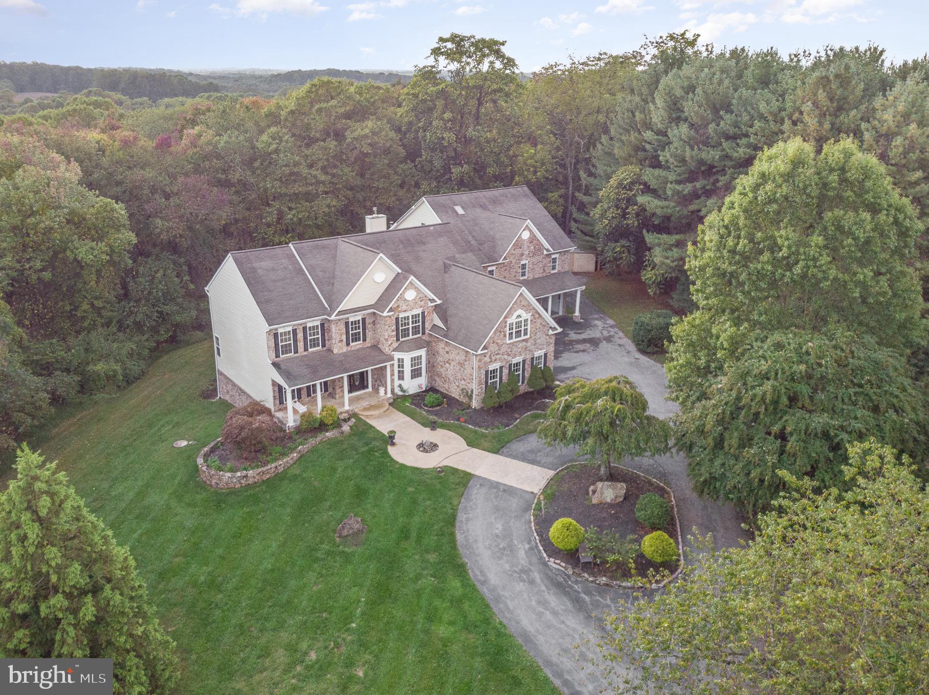 818 Hoods Mill Road Cooksville, MD 21723 - Photo 3 of 108 an aerial view of a house with a garden