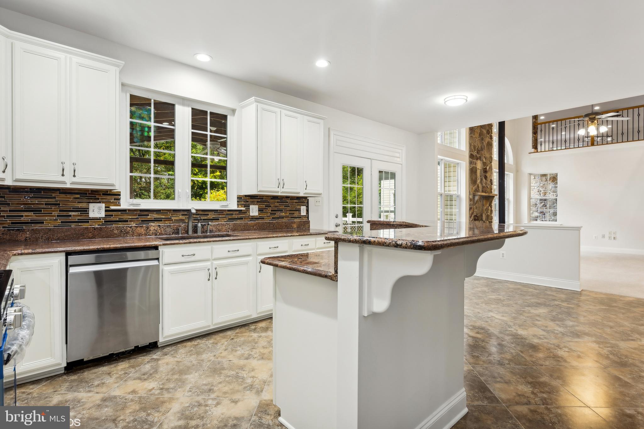818 Hoods Mill Road Cooksville, MD 21723 - Photo 33 of 108 a kitchen with stainless steel appliances granite countertop a stove a sink and a granite counter tops