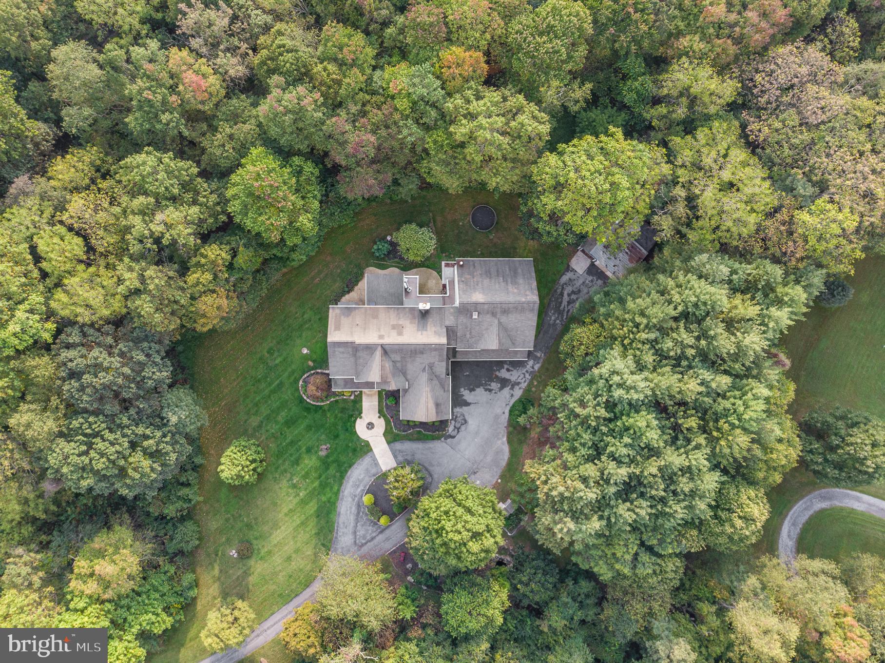 818 Hoods Mill Road Cooksville, MD 21723 - Photo 5 of 108 an aerial view of a house with a yard