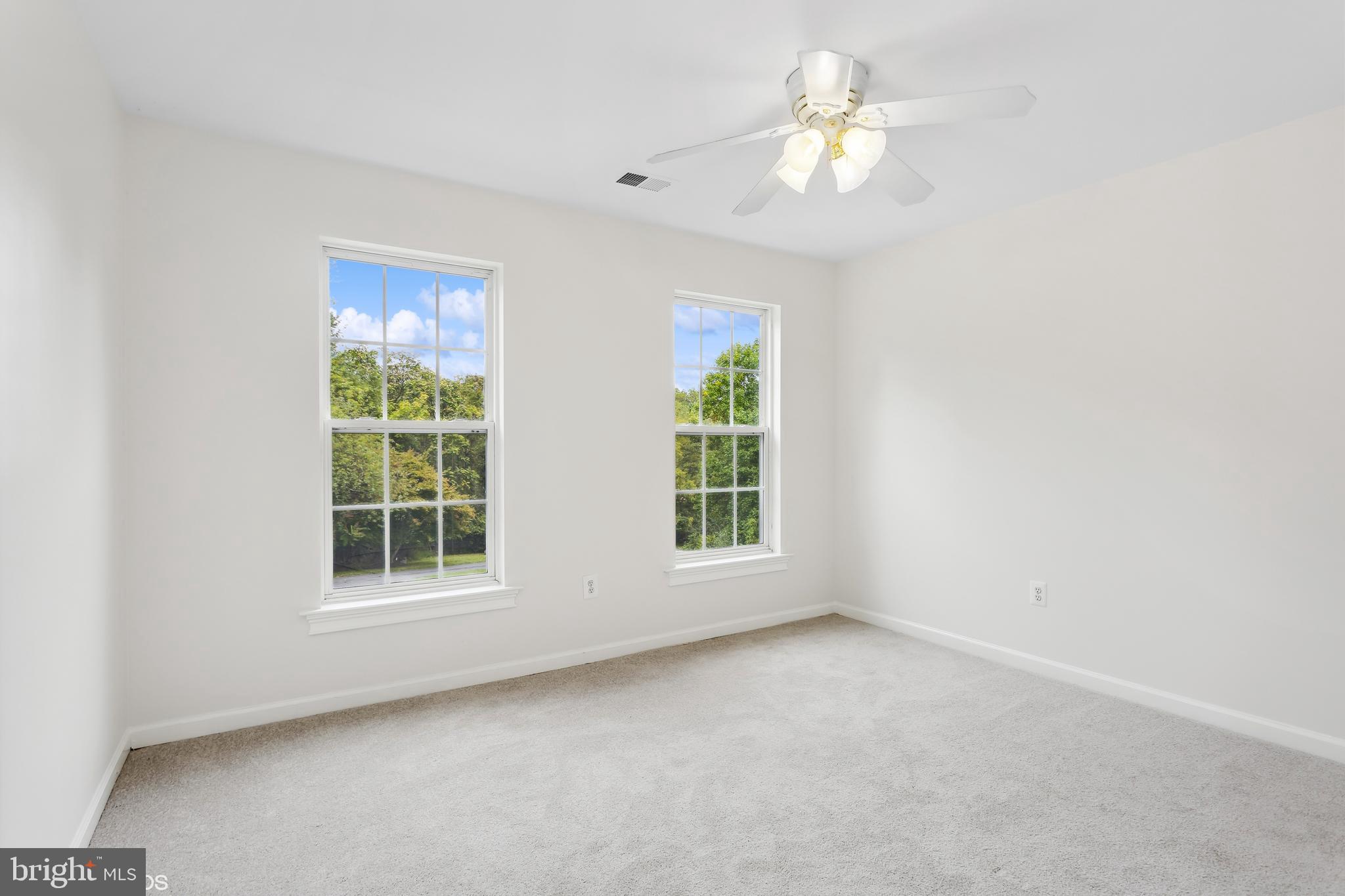 818 Hoods Mill Road Cooksville, MD 21723 - Photo 53 of 108 an empty room with a window and a fan
