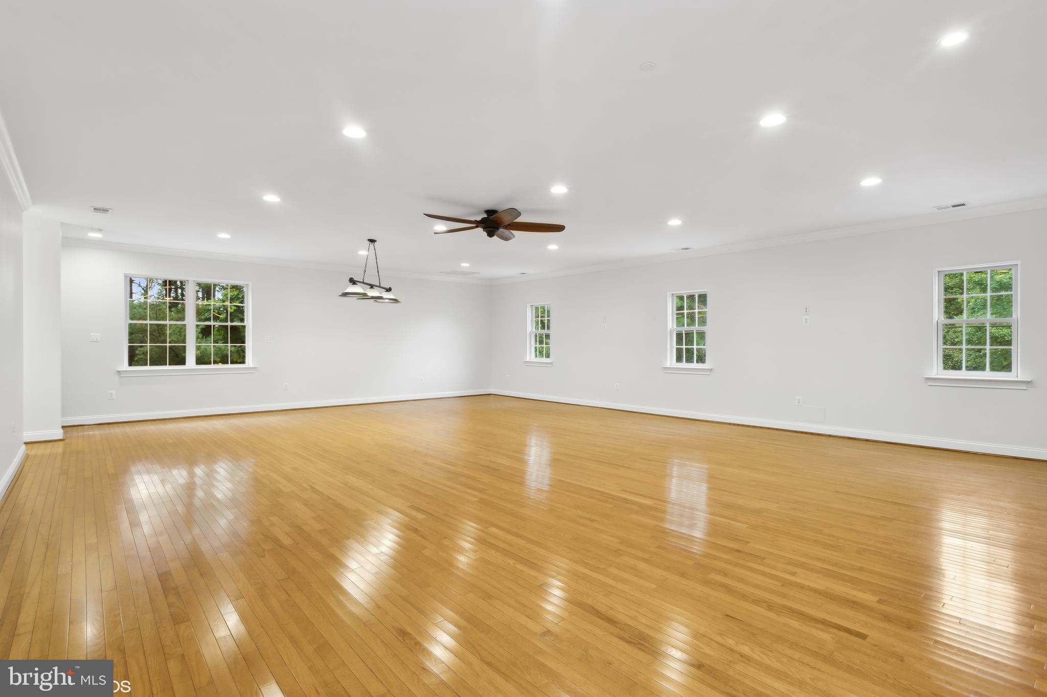 818 Hoods Mill Road Cooksville, MD 21723 - Photo 68 of 108 a view of an empty room with wooden floor and a window