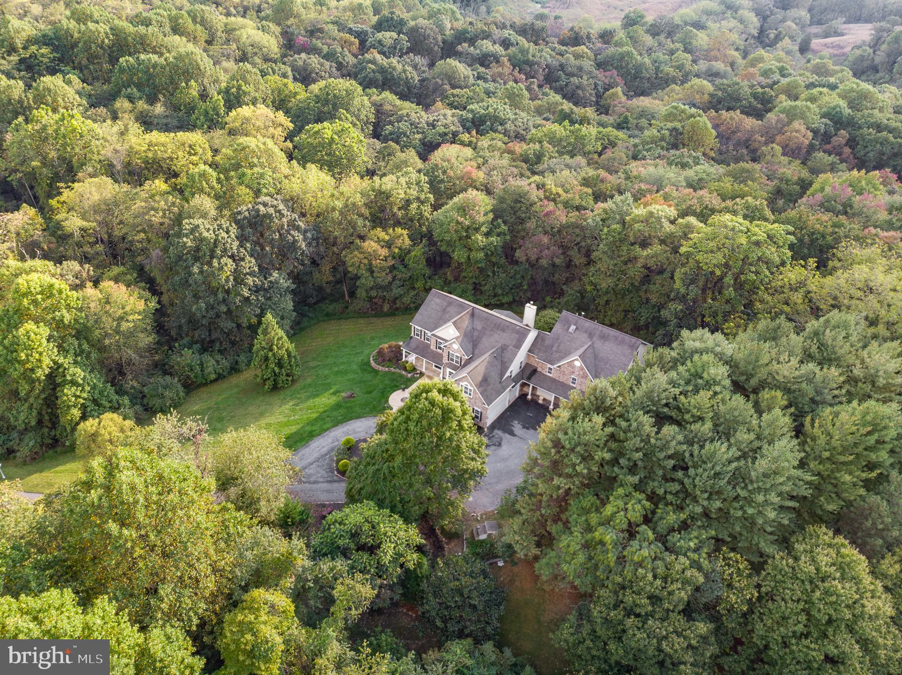 818 Hoods Mill Road Cooksville, MD 21723 - Photo 7 of 108 an aerial view of a house with yard and outdoor seating