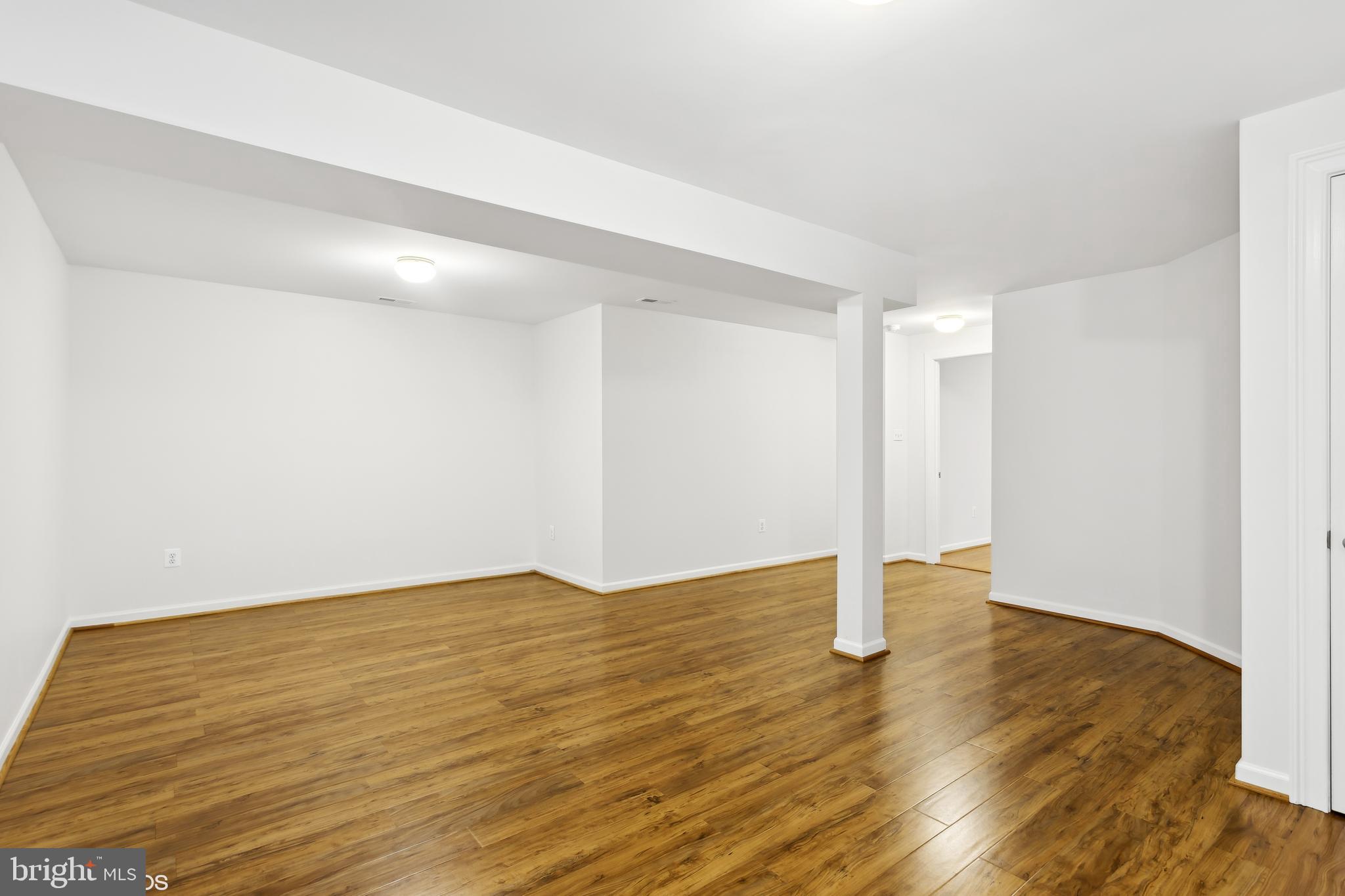 818 Hoods Mill Road Cooksville, MD 21723 - Photo 81 of 108 a view of an empty room with wooden floor