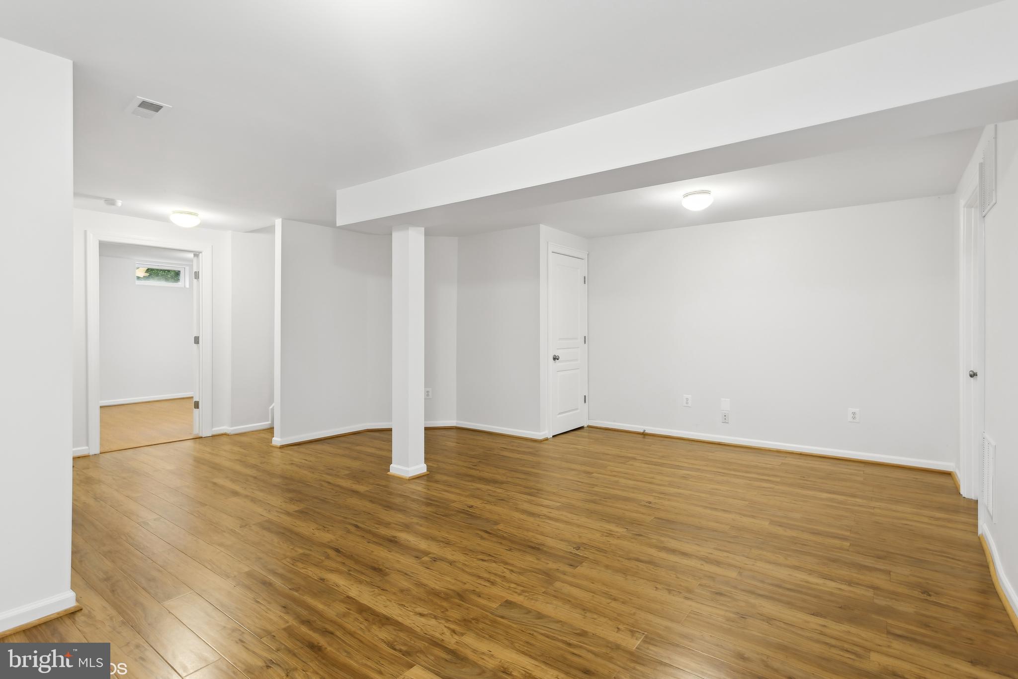818 Hoods Mill Road Cooksville, MD 21723 - Photo 82 of 108 a view of an empty room with wooden floor