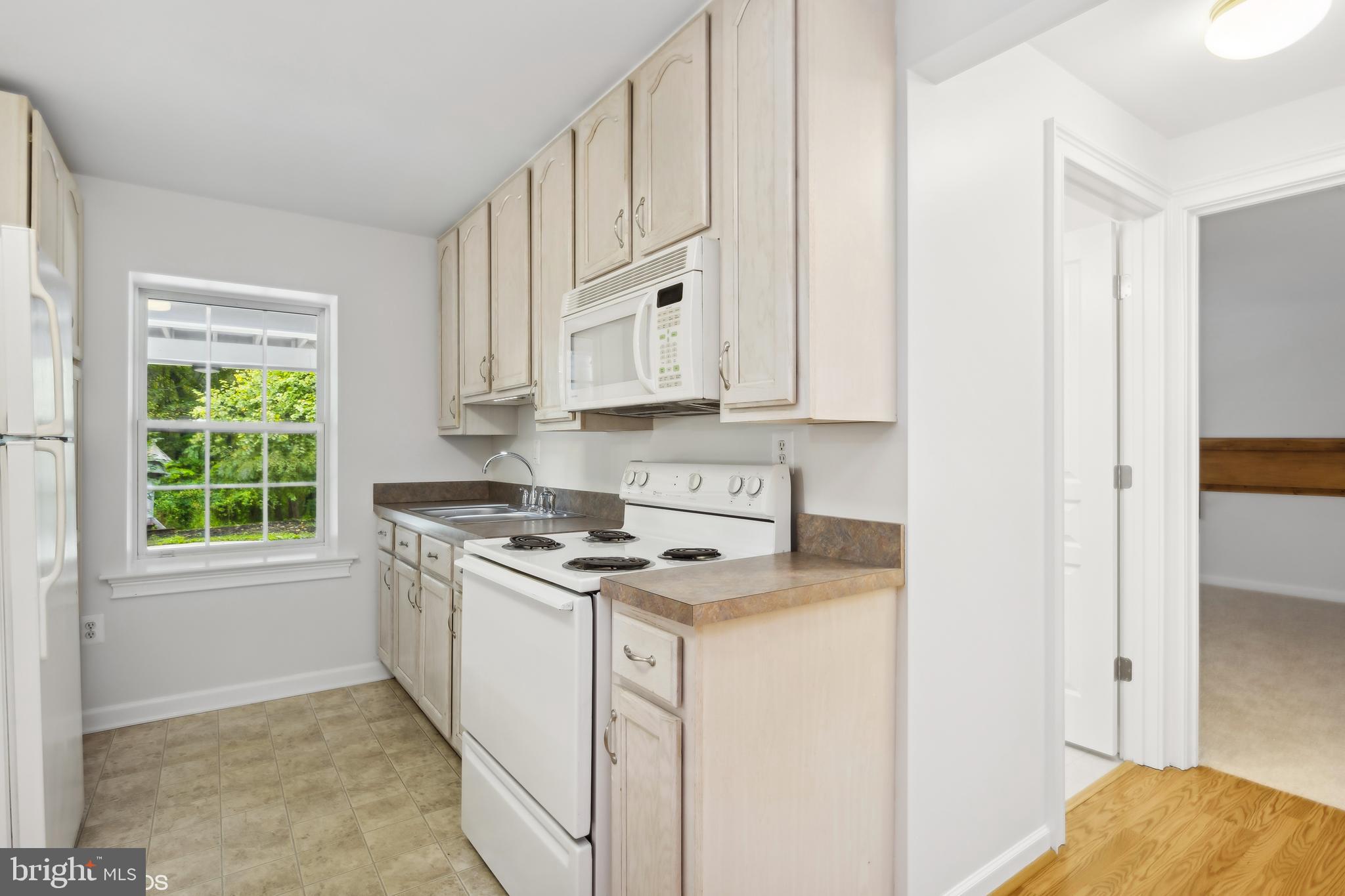 818 Hoods Mill Road Cooksville, MD 21723 - Photo 89 of 108 a kitchen with stainless steel appliances granite countertop a stove a sink and a refrigerator