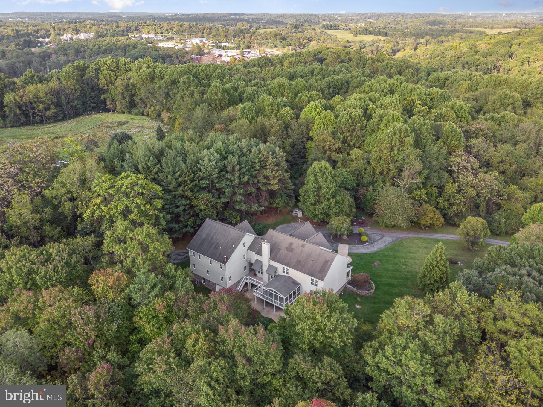 818 Hoods Mill Road Cooksville, MD 21723 - Photo 9 of 108 an aerial view of a house with yard