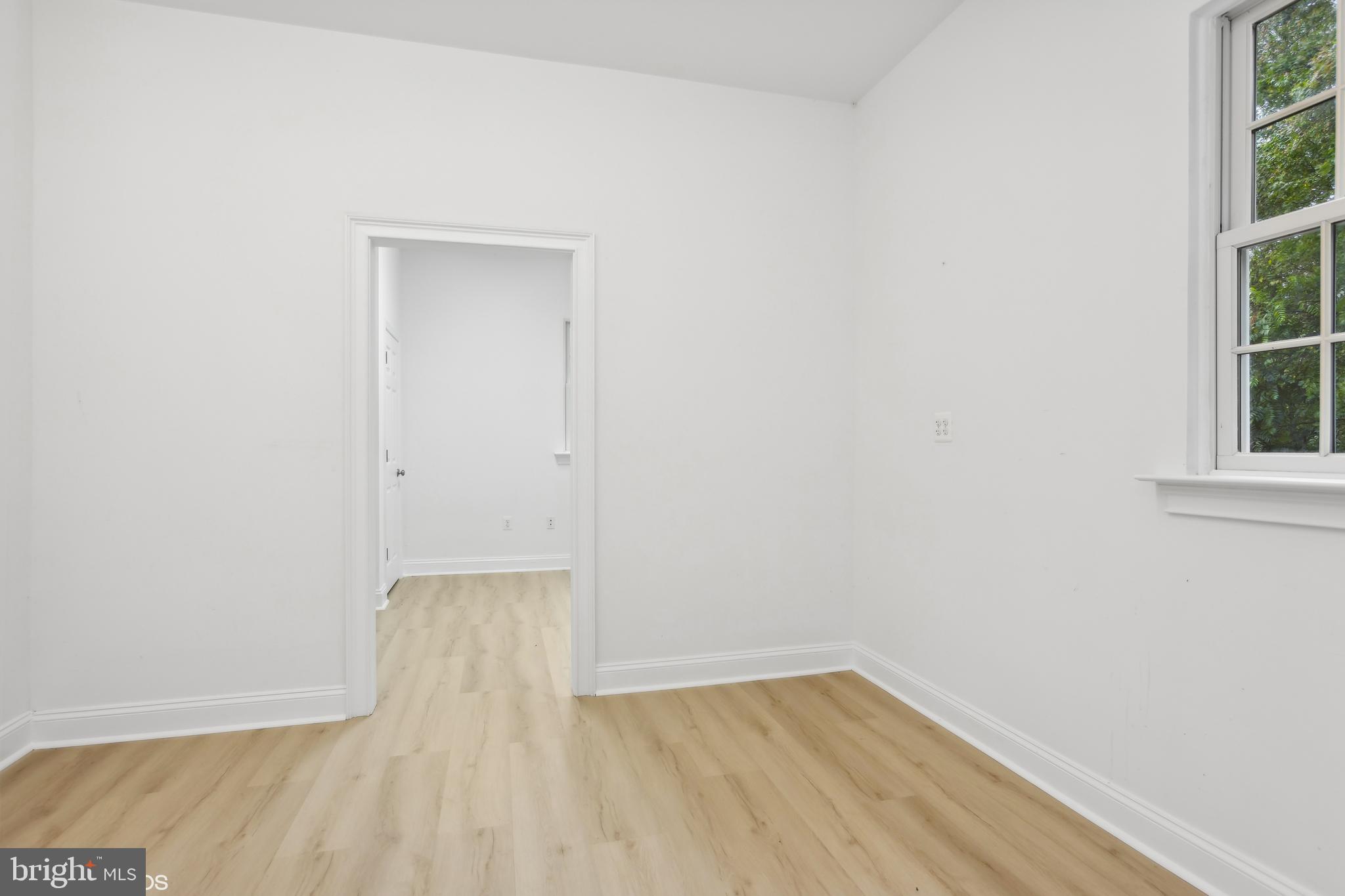 818 Hoods Mill Road Cooksville, MD 21723 - Photo 97 of 108 a view of an empty room with wooden floor and windows