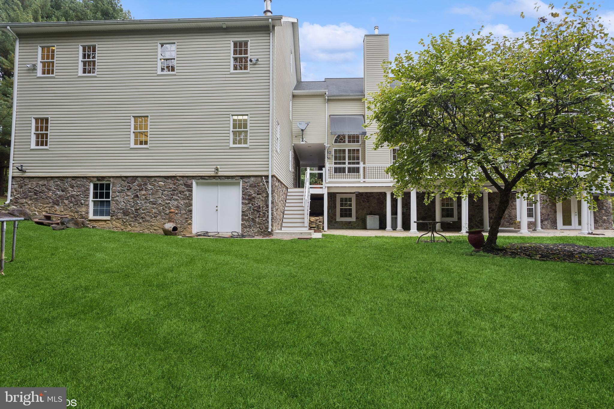 818 Hoods Mill Road Cooksville, MD 21723 - Photo 99 of 108 a front view of a house with a garden
