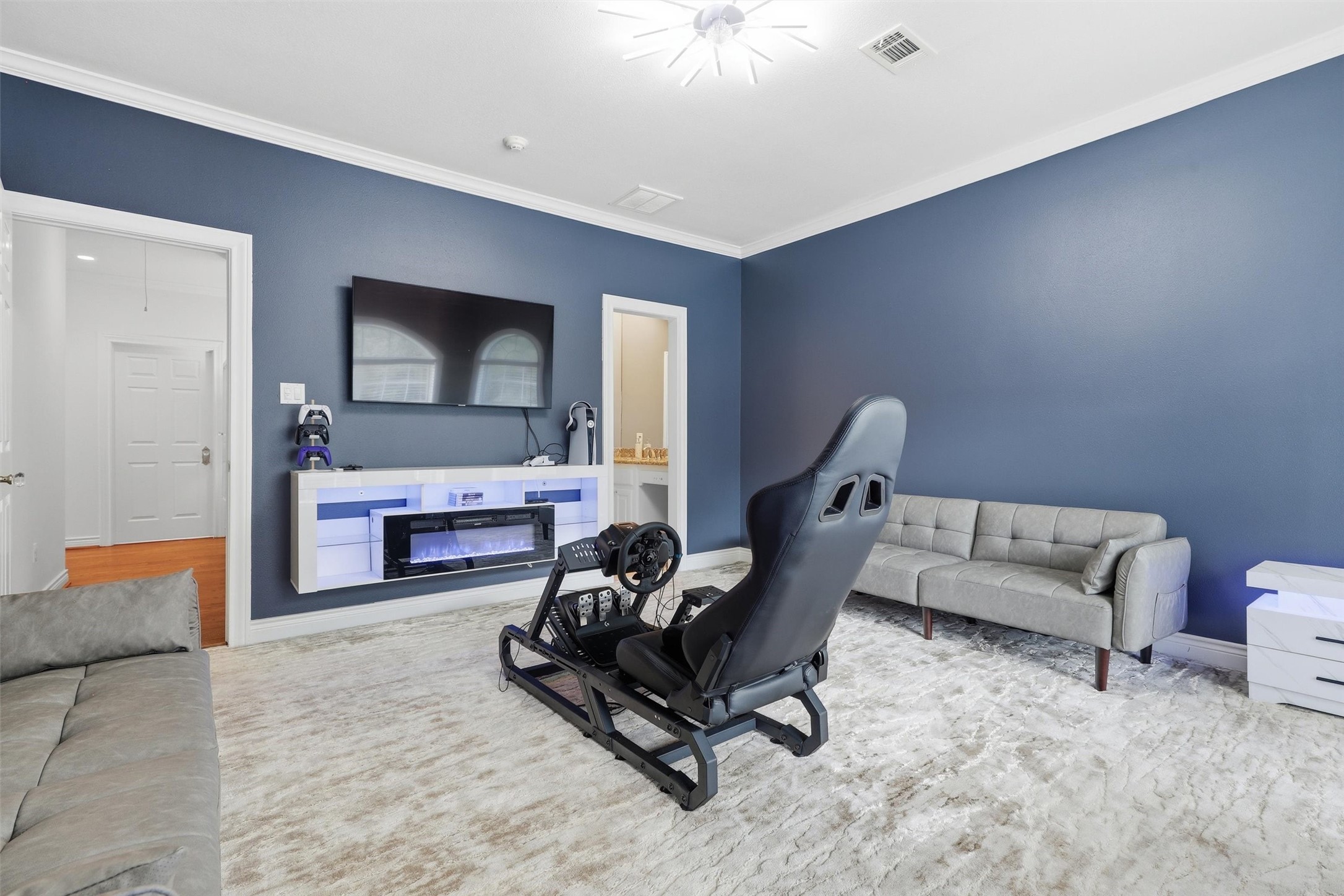 8582 Highway 75 Huntsville, TX 77340 - Photo 34 of 50 a living room with furniture and a flat screen tv
