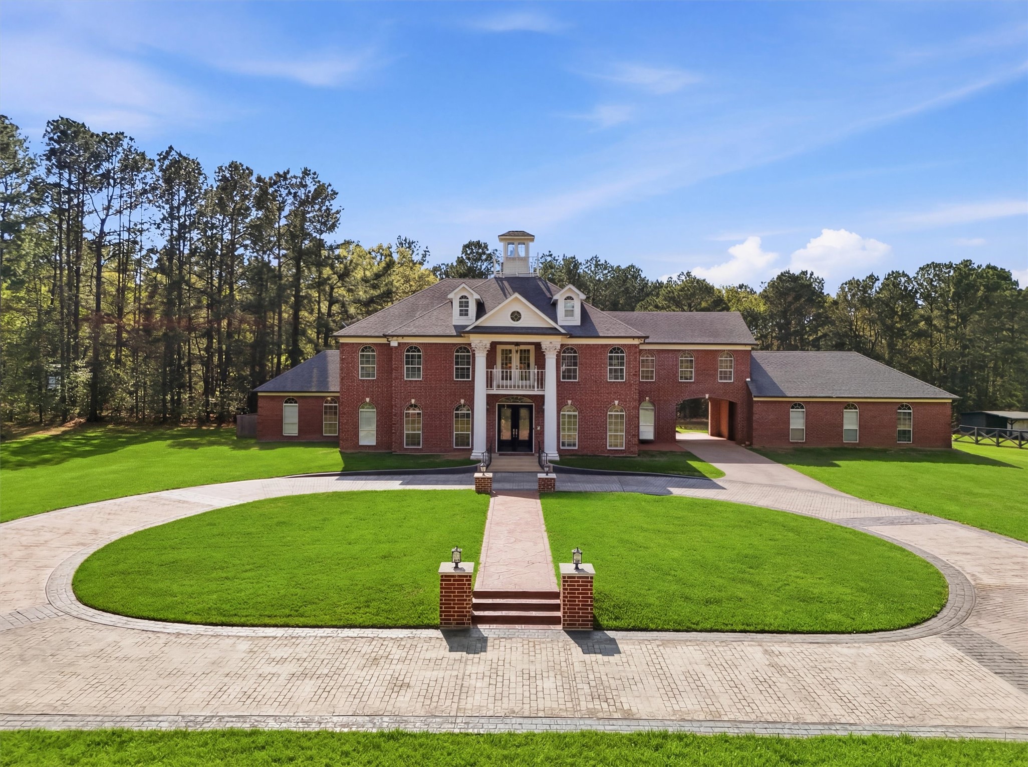 8582 Highway 75 Huntsville, TX 77340 - Photo 45 of 50 a front view of a house with a yard and garage