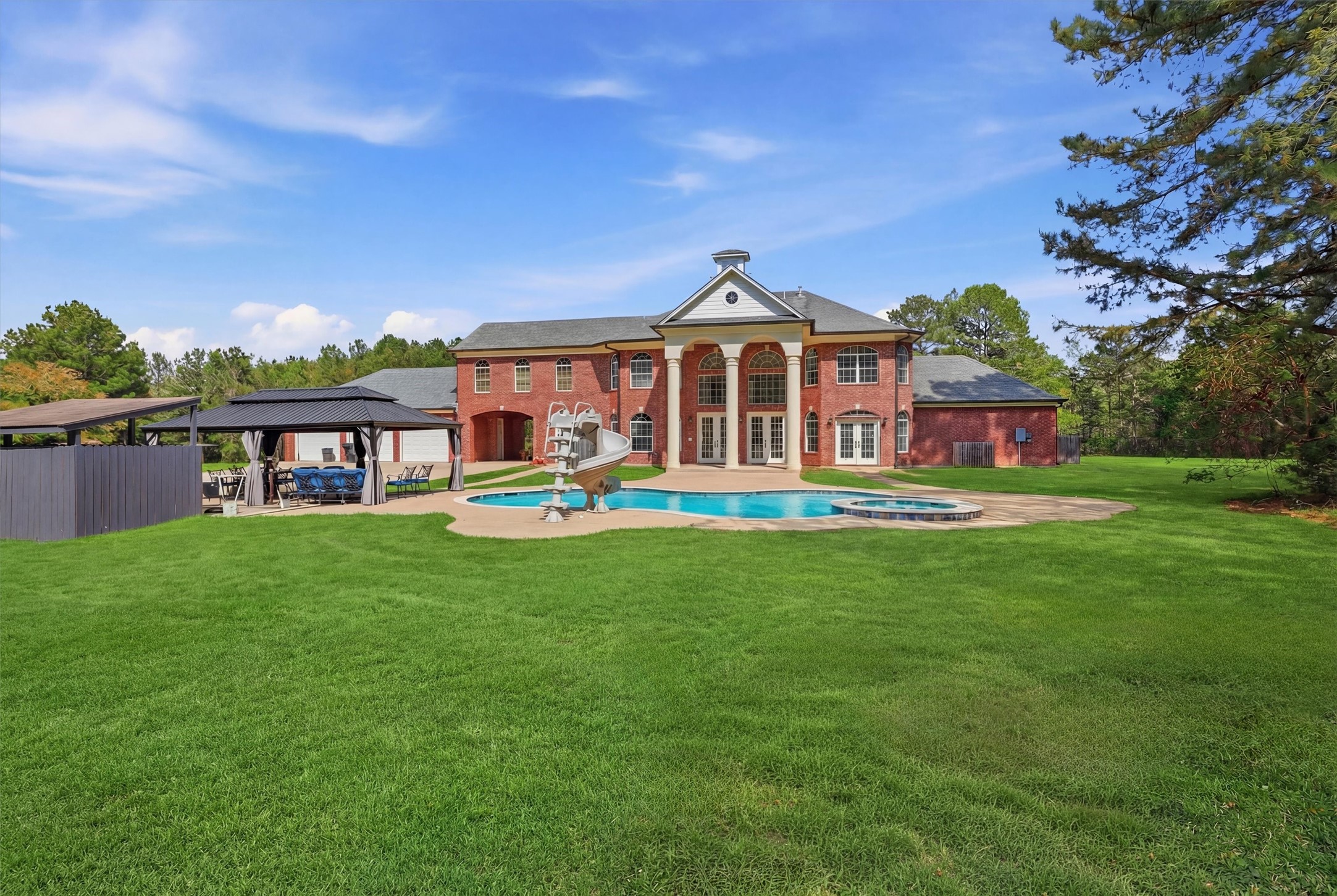 8582 Highway 75 Huntsville, TX 77340 - Photo 46 of 50 a front view of a house with a yard table and chairs